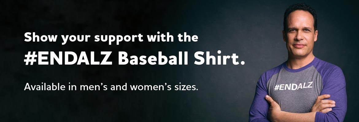 Man wearing #ENDALZ baseball shirt. Available in men's and women's sizes.